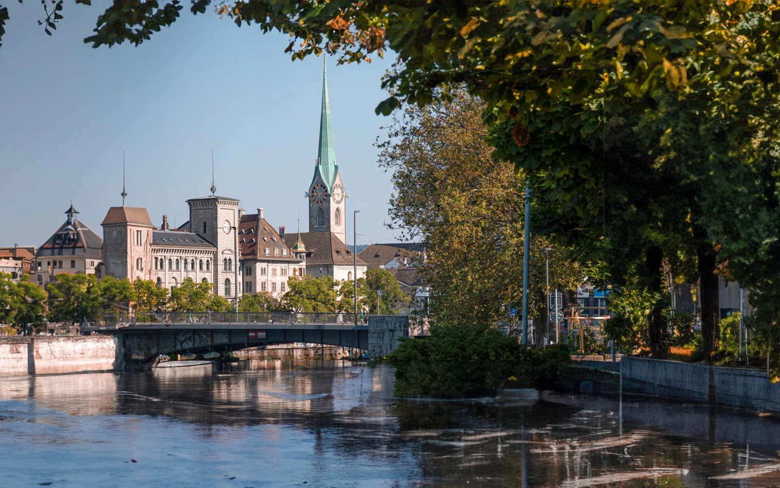 The Limmat river and historic buildings beside Fraumünster church in Zurich.