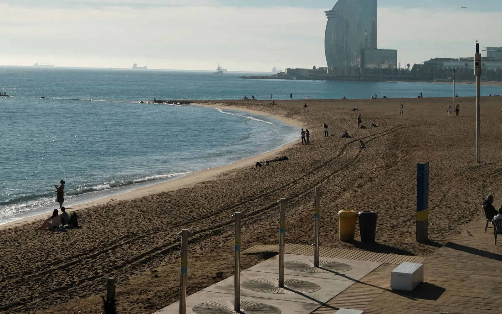The coast at Barceloneta with the W Barcelona building in the distance.