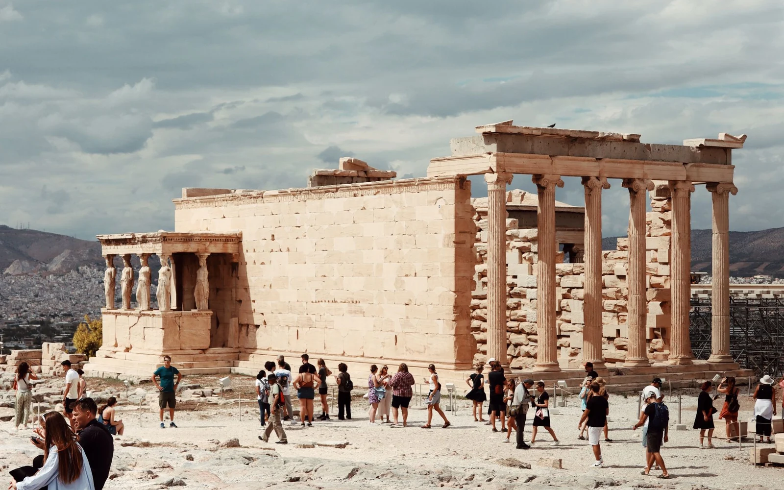 Visitors beside the Erechtheion on the Acropolis of Athens.