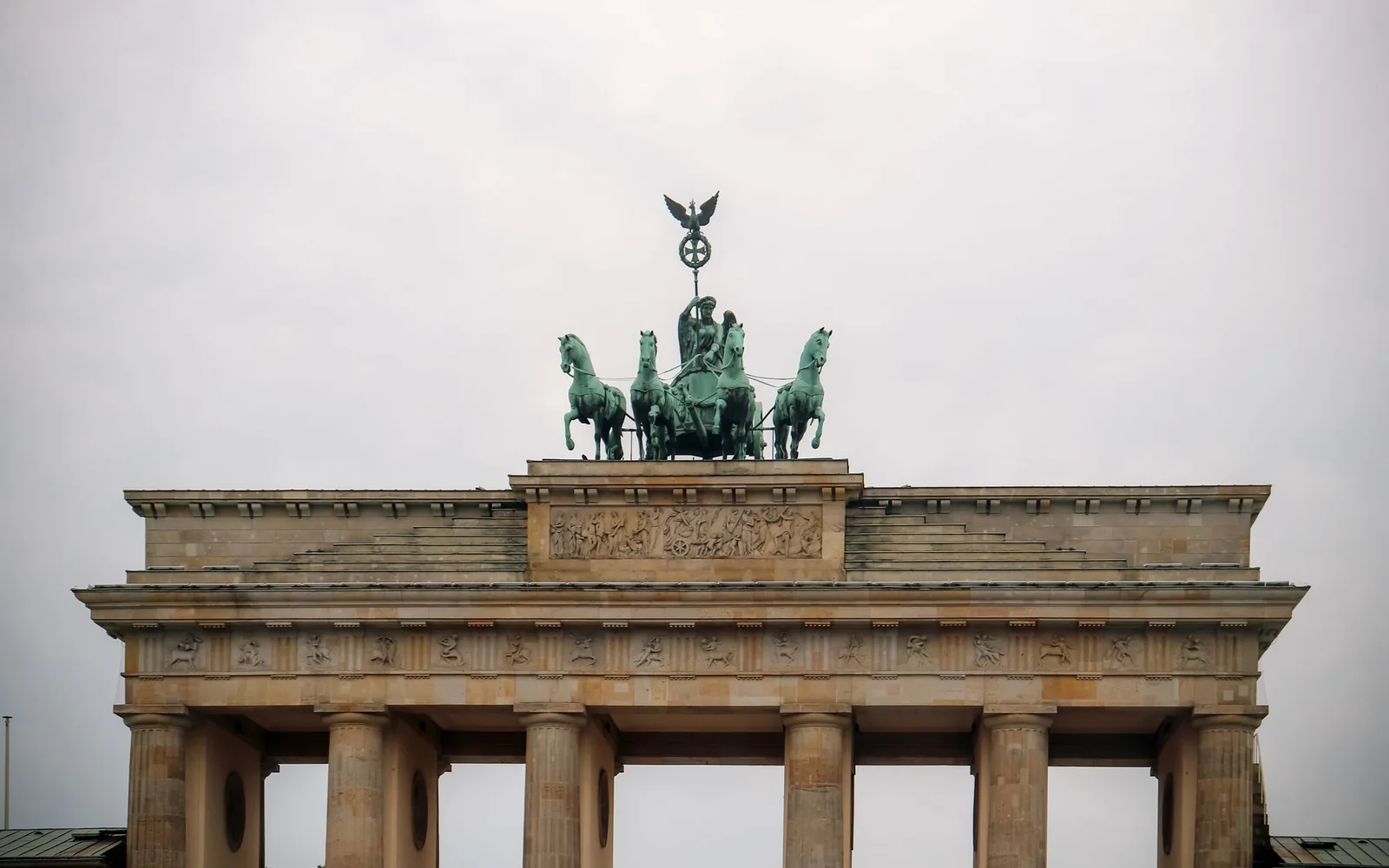 Berlin's Brandenburg Gate and its quadriga above the columns.