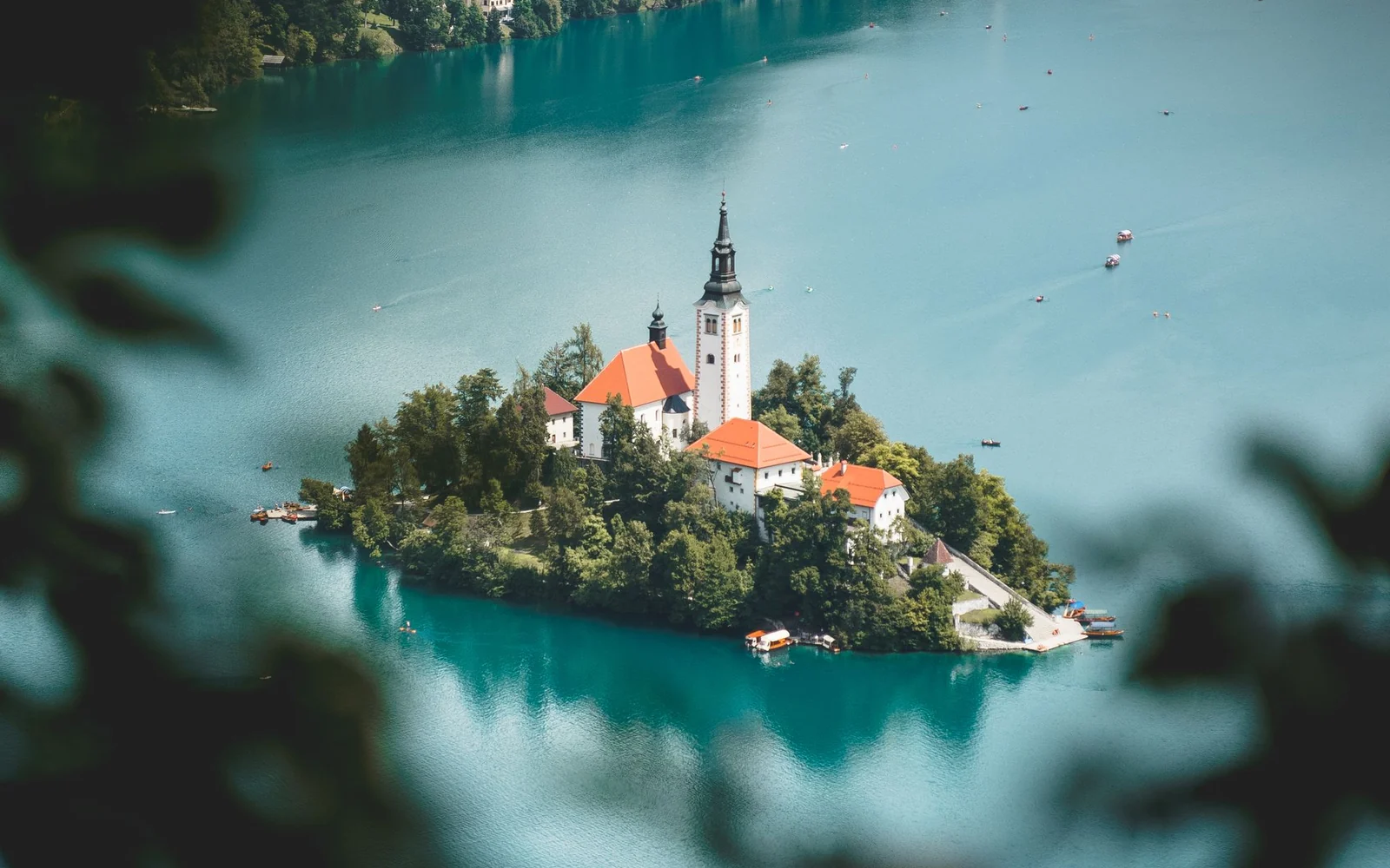 The island church surrounded by the turquoise water of Lake Bled in Slovenia.
