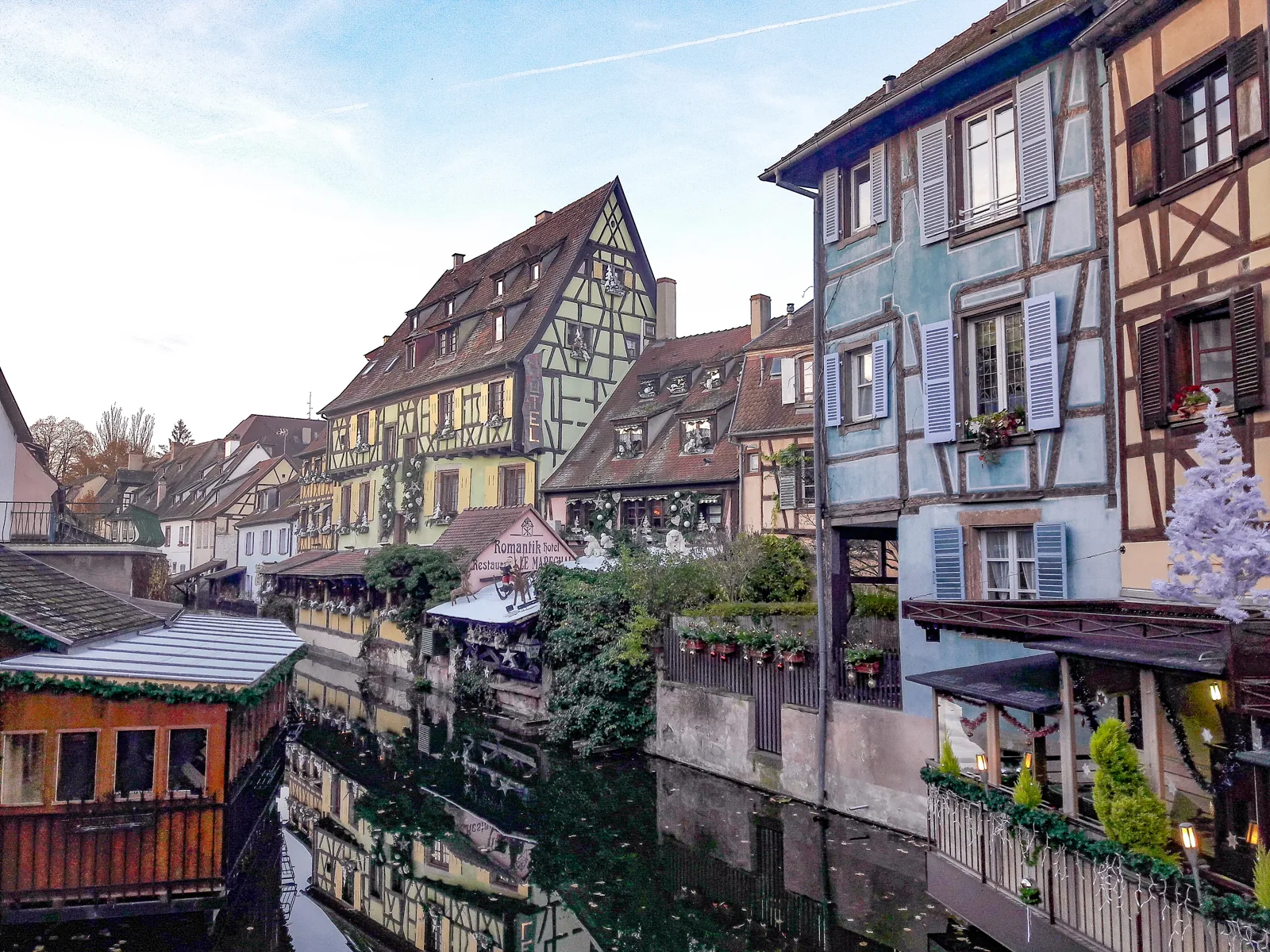 Christmas decorations above the canal and half-timbered houses in Colmar’s Petite Venise, photographed in 2017.