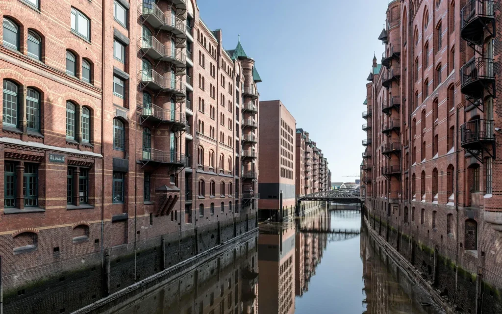 Brick warehouses and canal reflections in Hamburg&rsquo;s Speicherstadt, Germany.