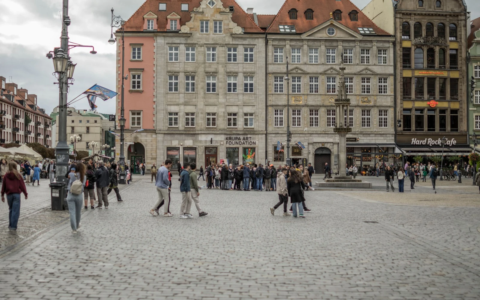 Townhouses and pedestrians in Wrocław’s historic Market Square.